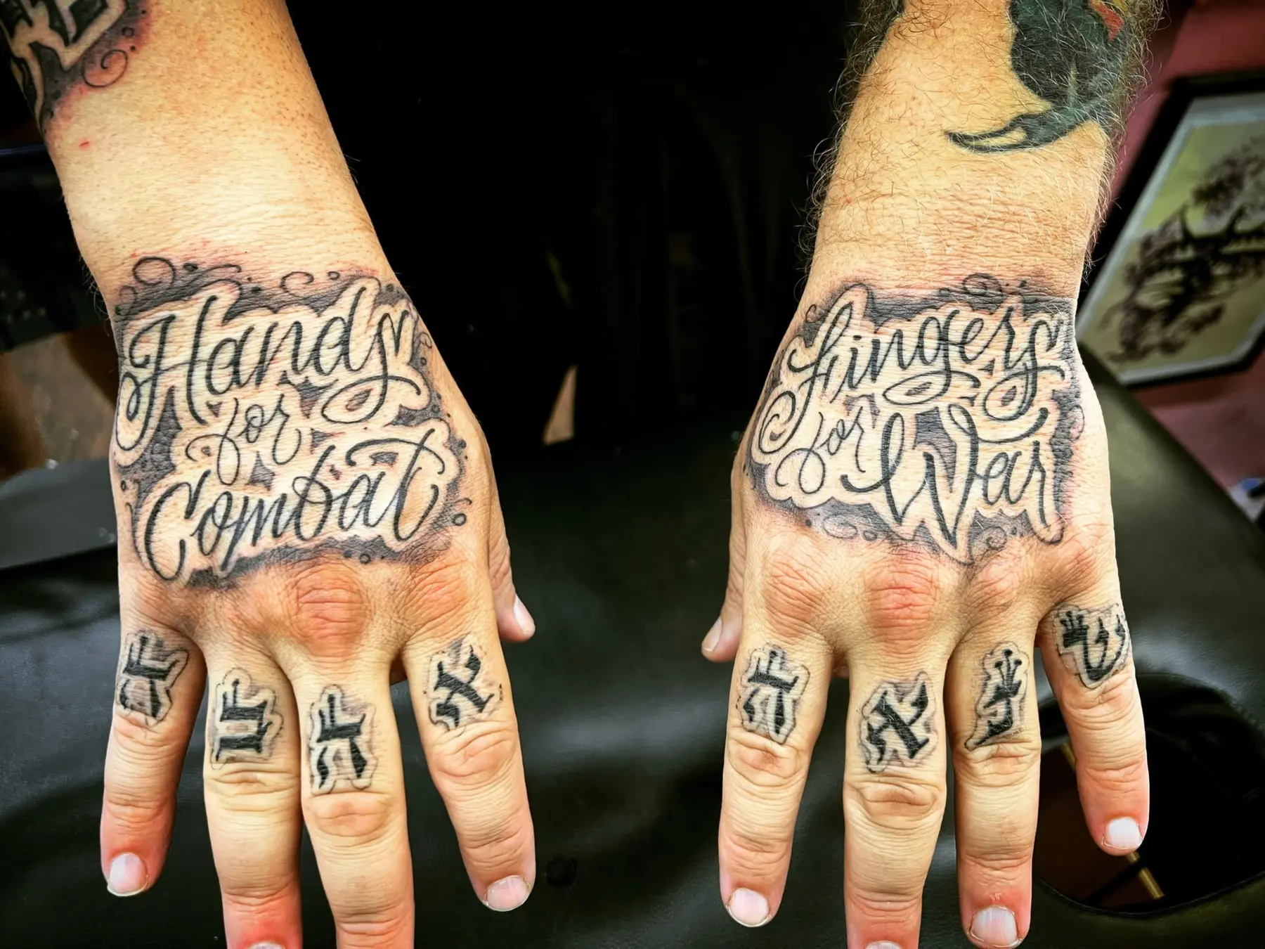 Hand tattoos reading Hands for Combat and Fingers for Weaving