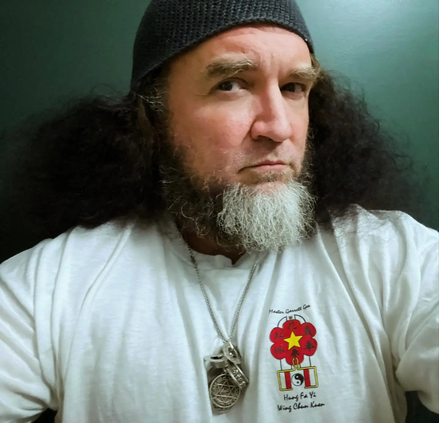 Portrait of Dr. Micah Naziri in a Wing Chun lineage shirt