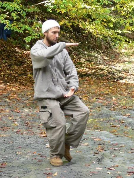 Dr. Micah Naziri practicing standing Qigong outdoors