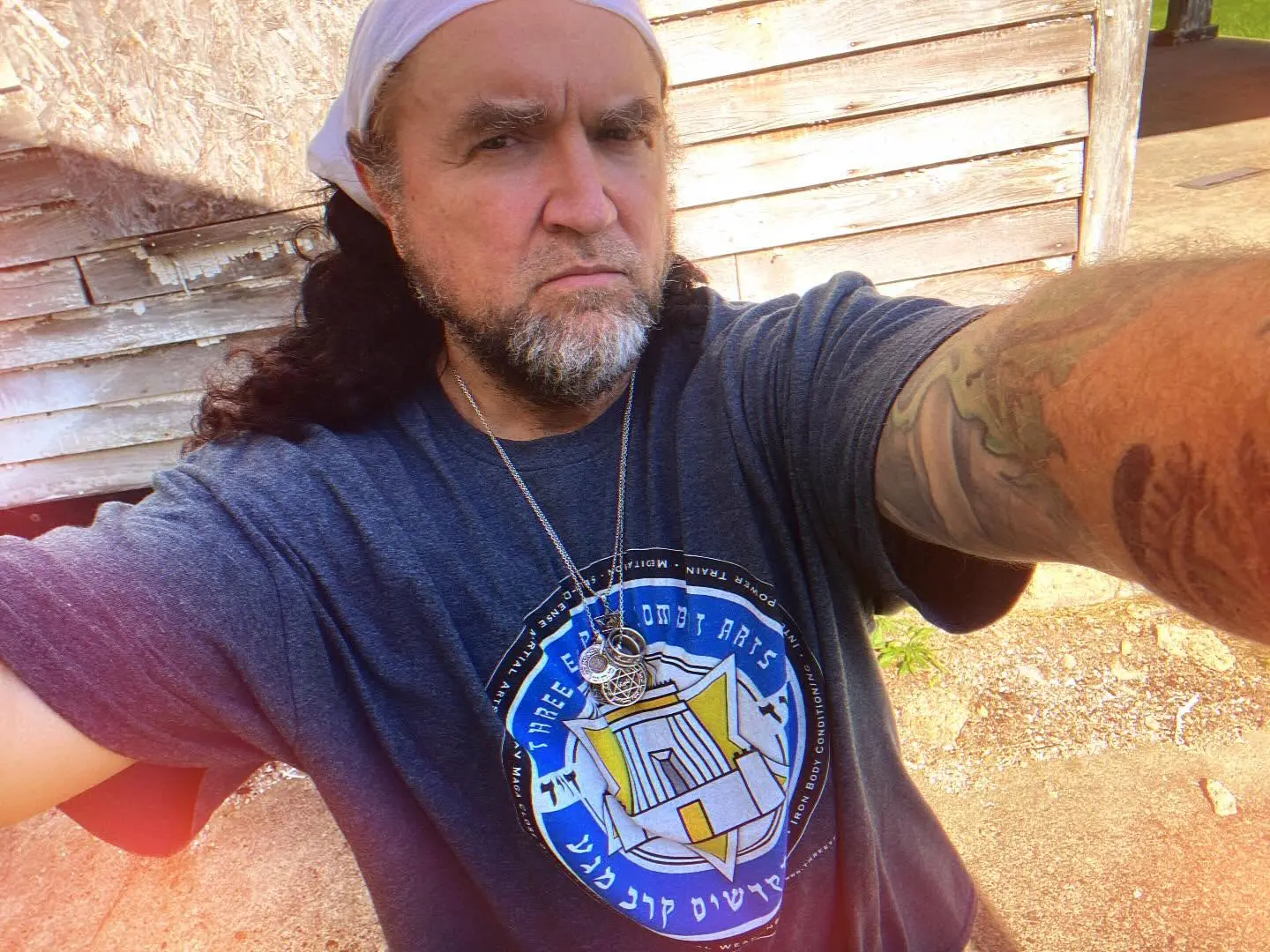 Dr. Micah Naziri wearing the Three Temples Combat Arts emblem
